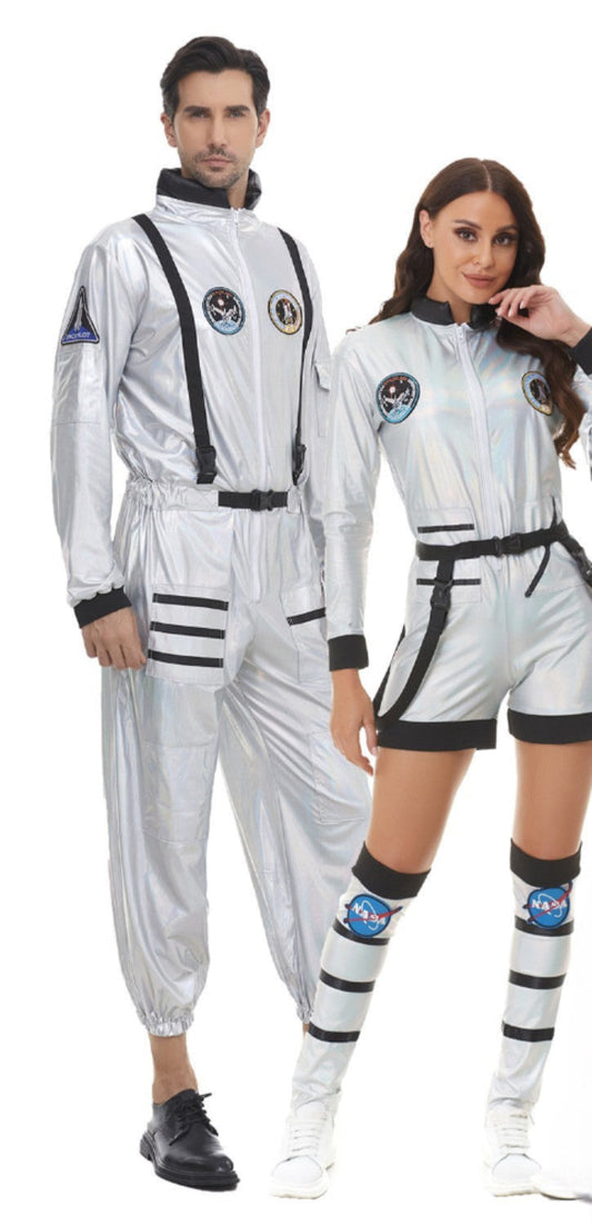 Adult couple wandering the earth in space suits